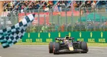  ?? GUGLIELMO MANGIAPANE/AP ?? Red Bull driver Max Verstappen of the Netherland­s crosses the finish line as he wins the Emilia Romagna Formula One Grand Prix, at the Enzo and Dino Ferrari racetrack in Imola, Italy, on April 24. This weekend, F1 makes its debut in Miami Gardens.