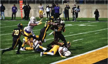  ?? (Pine Bluff Commercial/I.C. Murrell) ?? UAPB special teams players Lavonski Williams (20), Chris Newton (36) and Isaiah Singleton (31) tracked down a loose ball on a blocked Prairie View A&M punt near the goal line early in the second quarter Saturday at Simmons Bank Field. Daryl Carter blocked and recovered the punt.