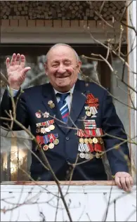  ??  ?? Second World War veteran Leonid Leonidovic­h Ilyushin is all smiles during a parade and outdoor concert organised by Russian Army servicemen to mark his 100th birthday