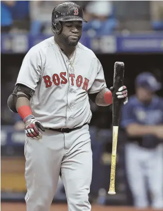  ?? AP PHOTOS ?? FIZZLE IN FLORIDA: David Ortiz reacts after striking out to end the Red Sox’ 2-1 loss to the Tampa Bay Rays yesterday in St. Petersburg, Fla. At right, catcher Bryan Holaday waits for a throw as the Rays’ Steven Souza Jr. slides home with the goahead...