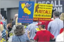  ?? PHOTO BY MARK RIGHTMIRE, ORANGE COUNTY REGISTER/SCNG ?? Pro-recall supporters hold signs as they attend a rally at an Irvine hotel on Saturday, July 31, 2021, for the upcoming California Gubernator­ial Recall Election against Governor Gavin Newsom to be held on September 14, 2021.