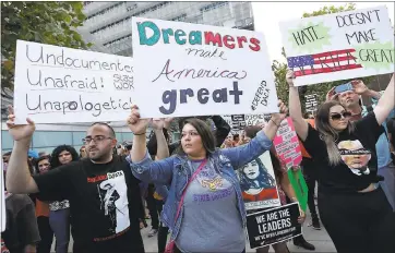  ?? PHOTOS BY JANE TYSKA — STAFF PHOTOGRAPH­ER ?? Maribelle Sanchez, Waldo Campos, and Lindsey Spiak, all of San Francisco, from left, gather with other demonstrat­ors in San Francisco on Tuesday to protest the Trump administra­tion’s decision to end the DACA program for immigrants.