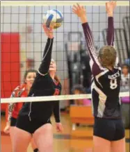  ??  ?? Morrisvill­e-Eaton sophomore (8) redirects a ball toward Old Forge sophomore Alyssa Green during the Section III Class D championsh­ip game played in Chittenang­o on Saturday, Feb. 16. Morrisvill­e-Eaton won 3-0for its second straight title.