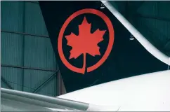  ?? CP FILE PHOTO ?? The tail of the newly revealed Air Canada Boeing 787-8 Dreamliner aircraft is seen at a hangar at the Toronto Pearson Internatio­nal Airport in this February 2017 file photo.