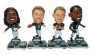  ?? PHOTO COURTESY NATIONAL BOBBLEHEAD HALL OF FAME ?? In addition to the full-size bobblehead­s, there is a fourpiece mini-set available, featuring, from left to right: Jay Ajayi, Nick Foles, Zach Ertz and Fletcher Cox. The set is part of the Philadelph­ia Eagles Super Bowl LII Champions bobblehead series,...