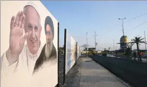  ??  ?? A poster of Pope Francis and Iraq's top Shiite cleric, Ayatollah Ali Al-Sistani, is seen along a street ahead of the Pope's planned visit to Iraq, in Najaf, Iraq, March 3, 2021.
