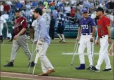  ?? AP PHOTO/ALEX BRANDON ?? Injured aide Zach Barth, left, and Rep. Roger Williams, R-Texas, also on crutches, walk off the field before the Congressio­nal baseball game, Thursday in Washington. The annual GOP-Democrats baseball game raises money for charity.