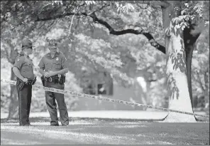  ?? Arkansas Democrat-Gazette/JEFF MITCHELL ?? State troopers stand watch Tuesday at Remmel Park in Newport as the investigat­ion in the Monday slaying of Newport police Lt. Patrick Weatherfor­d continues.