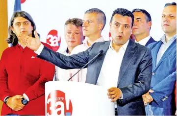  ??  ?? Zaev gives a speach during referendum night. — Reuters photo