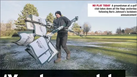  ??  ?? NO PLAY TODAY A groundsman at a golf club takes down all the flags yesterday following Boris Johnson’s lockdown announceme­nt