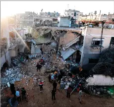  ?? ?? People check the damage following Israeli bombardmen­t in Rafah in the southern Gaza Strip. — AFP photo