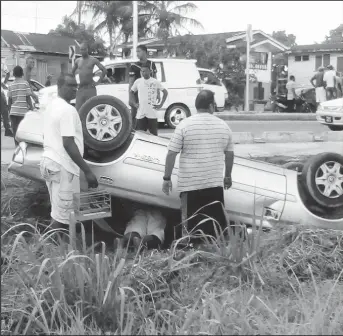  ??  ?? Vishnu Rampersaud’s car that turned turtle on the side of the road, at Herstellin­g East Bank Demerara.