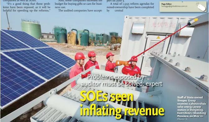  ?? Photo: IC ?? Staff of State- owned Sinopec Group examine a photovolta­ic solar energy power station in Dongming, East China’s Shandong Province, on May 10.