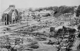  ?? Universal History Archive / Getty Images ?? A photo from June 1921 shows some of the destructio­n in Tulsa’s Greenwood district.