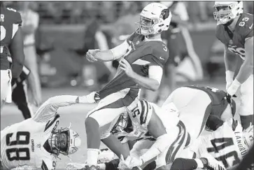  ?? Ross D. Franklin Associated Press ?? DEFENSIVE END Isaac Rochell, who sacked two Seattle quarterbac­ks in the Chargers’ preseason win Saturday, pulls down Arizona Cardinals quarterbac­k Josh Rosen (3) here during a Week 1 preseason loss.