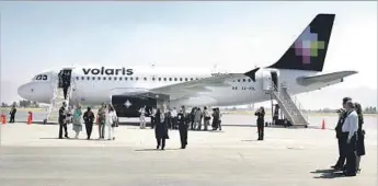  ?? Claudio Cruz Associated Press ?? Visitors observe a Volaris airplane at the Ciudad de Toluca airport, Mexico, Monday, March 13, 2006. Today the low budget airline initiates f lights throughout Mexico. (AP Photo/ Claudio Cruz)