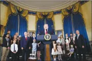  ?? AP PHOTO BY ALEX BRANDON ?? President Donald Trump, accompanie­d by Vice President Mike Pence, Health and Human Services Secretary Tom Price, and others, speaks about healthcare, Monday, in the Blue Room of the White House in Washington.