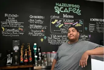  ?? Lucy Schaly/Post-Gazette photos ?? Dasawn Gray, 23, is the owner of the Hazelwood Cafe on Second Avenue.