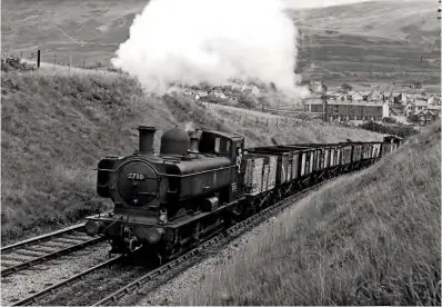  ?? W A C SMITH/RM ARCHIVE ?? GWR ‘8750’ 0-6-0PT No. 3730 works upgrade near Blaen Rhondda, on the Treherbert to Neath line, with empty mineral wagons on August 28, 1958.