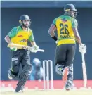  ?? FILE ?? Imad Wasim (left) and Carlos Brathwaite (right) of Jamaica Tallawahs cross for a run during the 2021 Hero Caribbean Premier League match at Warner Park Sporting Complex on Sunday, September 5, 2021.