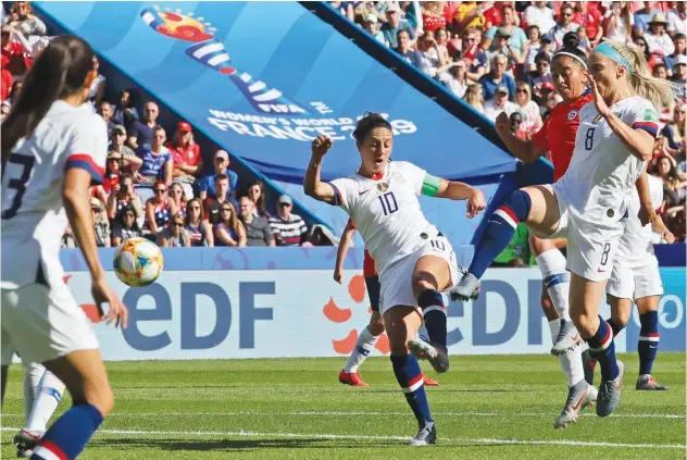  ?? Associated Press ?? ↑ US’ Carli Lloyd (centre) scores against Chile during their Women’s World Cup Group F match in Paris on Sunday.