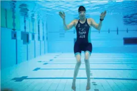  ?? Photograph: Mike Bowers/The Guardian ?? Triathlete Emily Tapp trains at the AIS pool in Canberra prior to leaving for the Tokyo 2020 Paralympic­s.