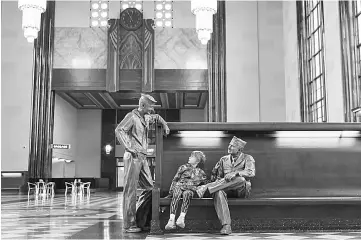  ??  ?? Kelley, nine, seems to be regalled by the stories of these servicemen, two of the life-like statues placed around the Durham Museum in Omaha, in the 86-year-old confines of the former Union Station.