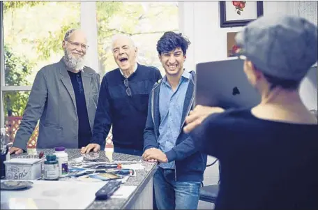  ?? Photograph­s by Joe Pugliese Netf lix ?? DAVID Letterman, from left, chats with George Clooney’s father, Nick, and University of Chicago student and Iraqi refugee Hazim Avdal.