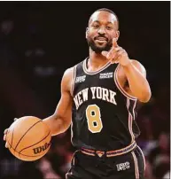  ?? John Minchillo / Associated Press ?? Knicks guard Kemba Walker dribbles up the court during the second half against the Brooklyn Nets on Feb. 16 in New York.