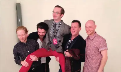  ??  ?? Dan Martin, centre, being hoisted aloft by members of Biffy Clyro at the 2013 NME awards. Photograph: Eve Barlow