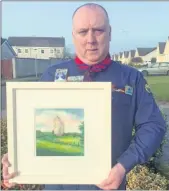  ??  ?? Pa Cotter was presented with a painting of Kilworth Castle by Fiona Turley as he steps down from his position as County Chairperso­n with the North Cork Scouting Committee.