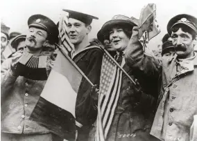  ??  ?? FAR LEFT Soldiers, seamen and Red Cross workers celebrate in Paris, 1918