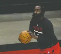  ?? CARMEN MANDATO/ GETTY IMAGES ?? Disgruntle­d Rockets star James Harden denies partying at a strip club, but the NBA still fined him for not wearing a mask at a social event, a violation of the league's COVID-19 safety rules.