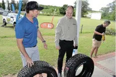  ?? Picture: MARK CARRELS ?? SAFETY FIRST: Tyremart Makhanda owner Robert van der Merwe discusses tyre specificat­ions at Salem Cricket Ground on December 3. On his right is general manager of parts company Tread Zone Robert Harris.