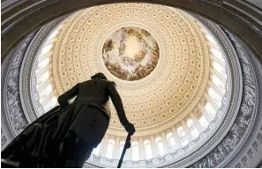  ?? The Associated Press ?? ■ The Rotunda of the U.S. Capitol is seen as a consequent­ial week begins for President Joe Biden’s agenda and Democratic leaders in Congress who are trying to advance his $3.5 trillion “Build Back Better” package and pass legislatio­n to avoid a federal shutdown in Washington on Monday,