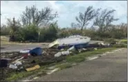  ?? SAMMY CLARK — MONROE COUNTY BOARD OF COUNTY COMMISSION VIA AP ?? This image released by the Monroe County Board of County Commission­ers shows debris along the Overseas Highway in the Florida Keys, Fla., Monday. Recovery along the island chain continues after Hurricane Irma made landfall on Sunday as a Category 4...