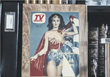  ??  ?? Lynda Carter at her Washington home, main, where lots of Wonder Woman memorabili­a is on display, above; by her star on Hollywood’s Walk of Fame, which was unveiled earlier this month, opposite top; performing in New York in 2010, opposite