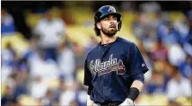  ?? KELVIN KUO / AP ?? Marietta’s Dansby Swanson, whose meteoric rise has hit a speed bump, hit just .214 in 95 games before his demotion.