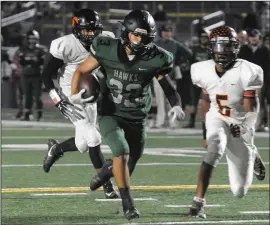  ?? BEA AHBECK/NEWS-SENTINEL ?? Above: Liberty Ranch's Jordan Besabe runs for a touchdown during the Hawks’ 47-30 playoff loss to Foothill at Hawk Stadium in Galt on Friday. Below:
Liberty Ranch's Tony Rangel runs for a touchdown