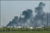  ?? YASUYOSHI CHIBA/AFP VIA GETTY IMAGES ?? Smoke rises from an oil refinary after shelling near Lysychansk, eastern Ukraine, on Monday.