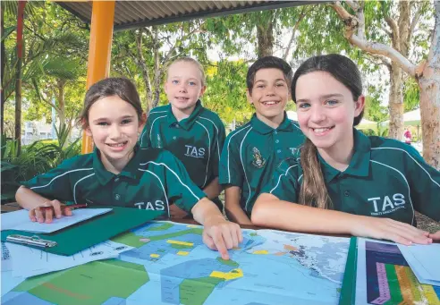  ?? Picture: JUSTIN BRIERTY ?? IDEAS: Trinity Anglian School Year 5 students, Beatrice Harris, 11, Ruby Colbridge, 11, Antonije Dimitrijev­ic, 11, and Ava Biskupski, 10, explore reef maps at the Cairns Future Leaders Eco Challenge.