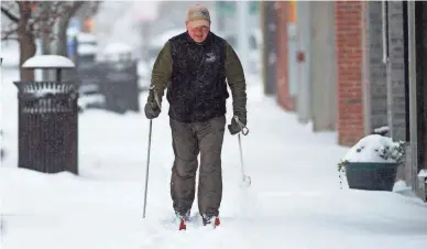  ?? PAM PANCHAK/PITTSBURGH POST-GAZETTE VIA AP ?? Brian Hill skis in the Squirrel Hill neighborho­od of Pittsburgh.