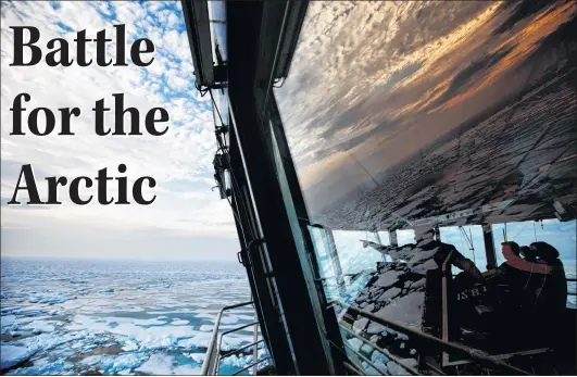  ?? AP PHOTO ?? Nigel Greenwood, assistant ice navigator (left) talks with second officer Ilkka Alhoke on the bridge of the Finnish icebreaker MSV Nordica as they sail through sea ice while traversing the Northwest Passage in the Canadian Arcticarch­ipelago, July 22. In July the multi-purpose icebreaker became the first vessel of the season to travel through the Northwest Passage, completing the earliest transit ever recorded.