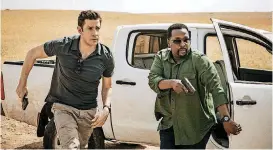  ?? [PHOTO BY JAN THIJS] ?? John Krasinski and Wendell Pierce star in “Tom Clancy’s Jack Ryan.”