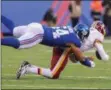  ?? PHOTO ED MULHOLLAND/GETTY IMAGES ?? Olivier Vernon #54 of the New York Giants sacks Kirk Cousins #8 of the Washington Redskins during the second half at MetLife Stadium on in East Rutherford, New Jersey. The Giants defeated the Redskins 18-10.