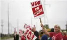  ??  ?? United Auto Workers members, including LeAnn Cramer, right, picket outside of the General Motors Lansing Delta Township plant on Monday. Photograph: Matthew Dae Smith/AP