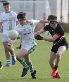  ??  ?? Luke Kavanagh of St. Peter’s tries to shake off Lee Pearson (St. Mary’s).