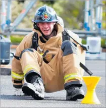  ?? PICTURE / DEBBIE BEADLE ?? OOPS: Kaitaia volunteer Isaac Berry comes up smiling after taking a tumble at a Firefighte­r Challenge in Kaikohe.