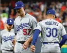  ?? EZRA SHAW/ GETTY IMAGES ?? Dodgers pitcher Alex Wood never wants to leave a game, but he’s OK with the Dodgers’ approach because it works.