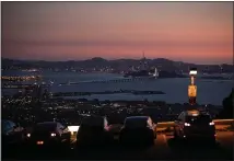  ?? RAY CHAVEZ — STAFF PHOTOGRAPH­ER ?? People in vehicles enjoy the view of the bay from a parking lot in the Berkeley hills on Thursday.